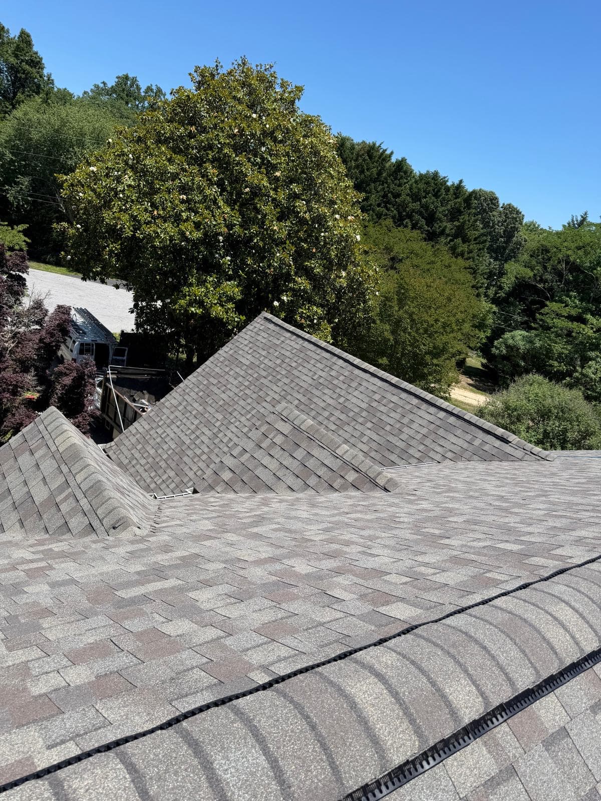Close view of finished roof valleys and new ridge venting