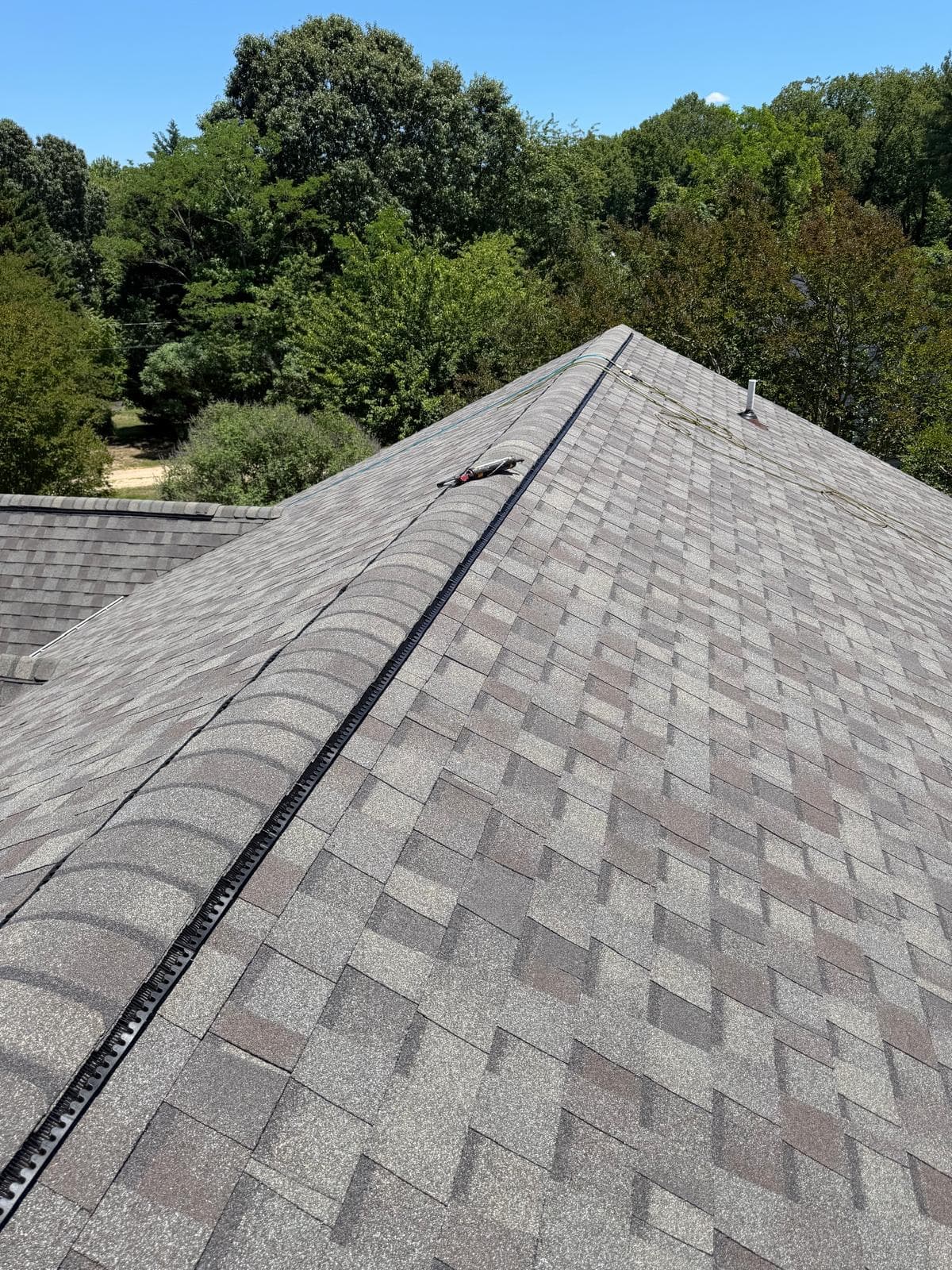 Close view of a finished ridge line with new ridge vent installed
